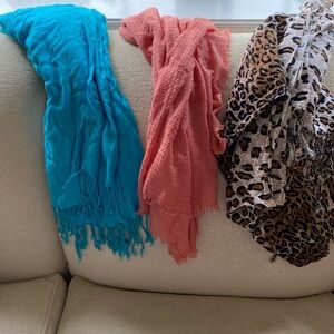 Three fabric scarves. Never worn. Lightweight and soft.